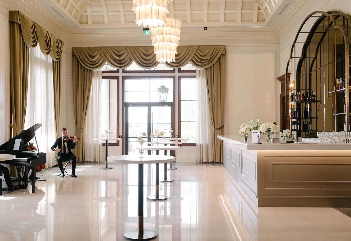 Musicians sitting in the Pluma room at Stone Eagle Winery.