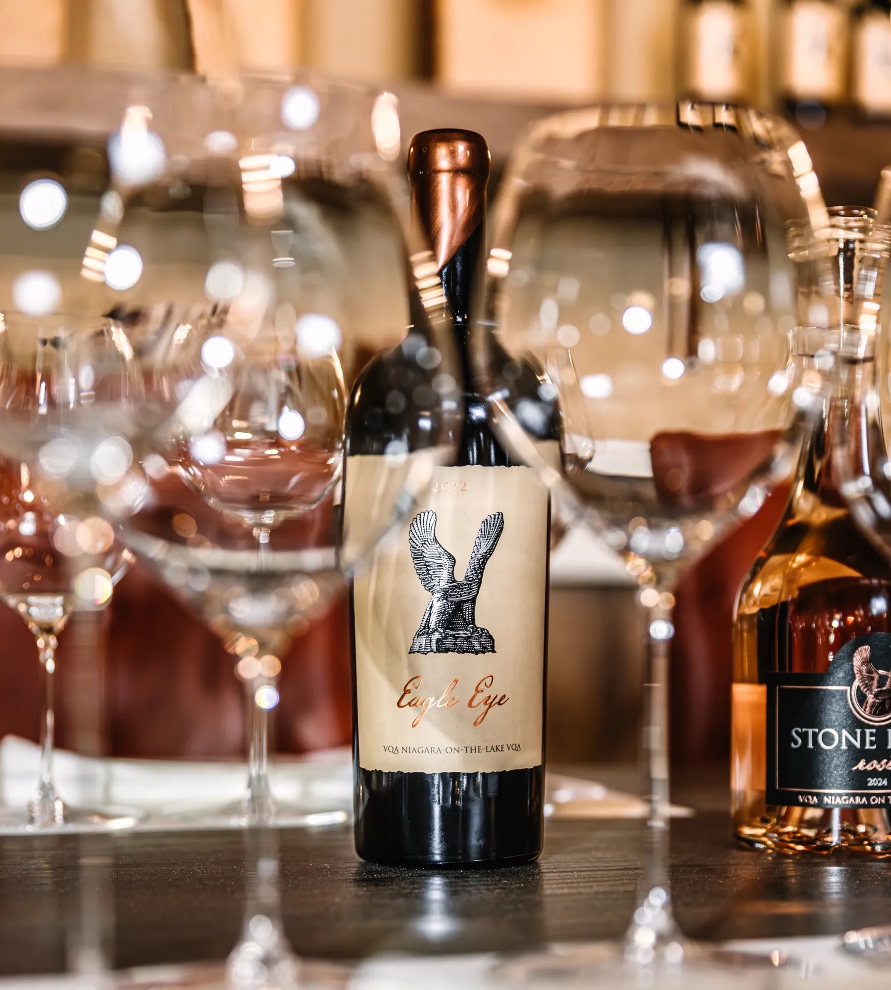 Bottle of Stone Eagle Eagle Eye surrounded by wine glasses